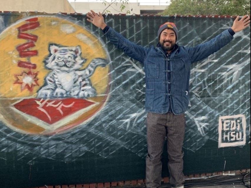 Holiday Magic Mural showing Year of the Tiger design with artist Edi Hsu