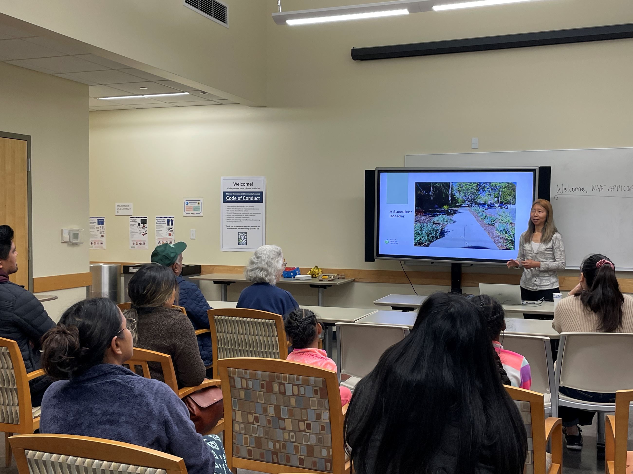Residents watching a presentation about succulents