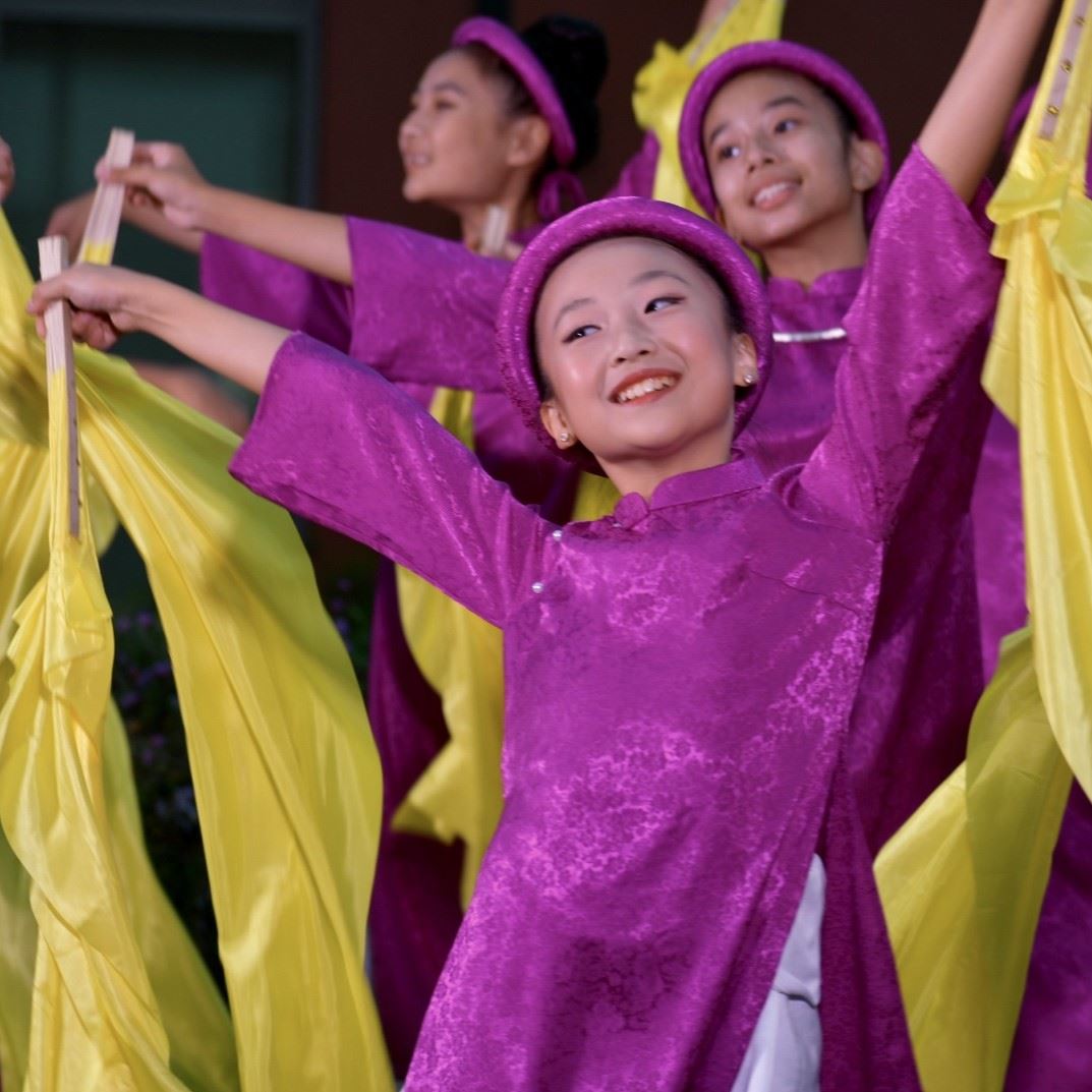 SQ Close up smiling girl dancer in purple wth yellow silk