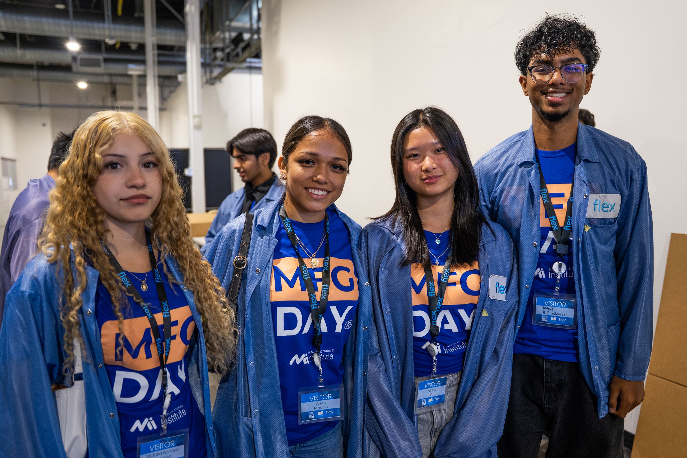 Four high school students ready to begin the facility tour