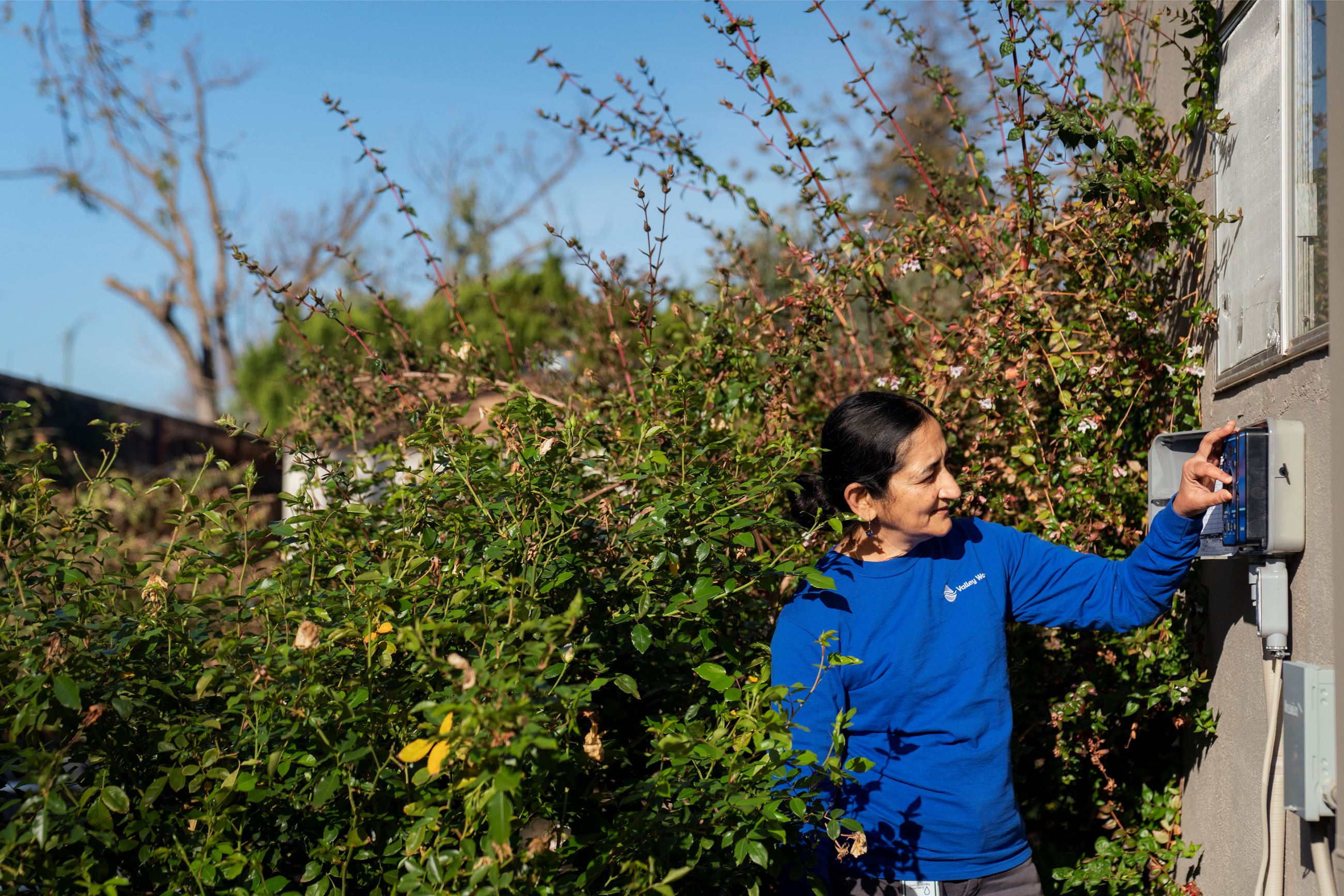 Irrigation specialist adjusting controller